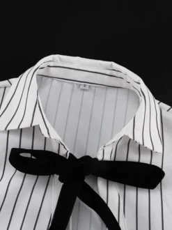 Blouse blanche pour femme col rabattu manches longues style décontracté avec nœuds.