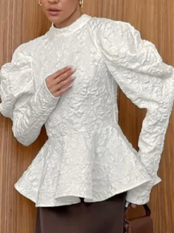 Blouse texturée en jacquard à manches bouffantes col montant taille péplum ourlet évasé