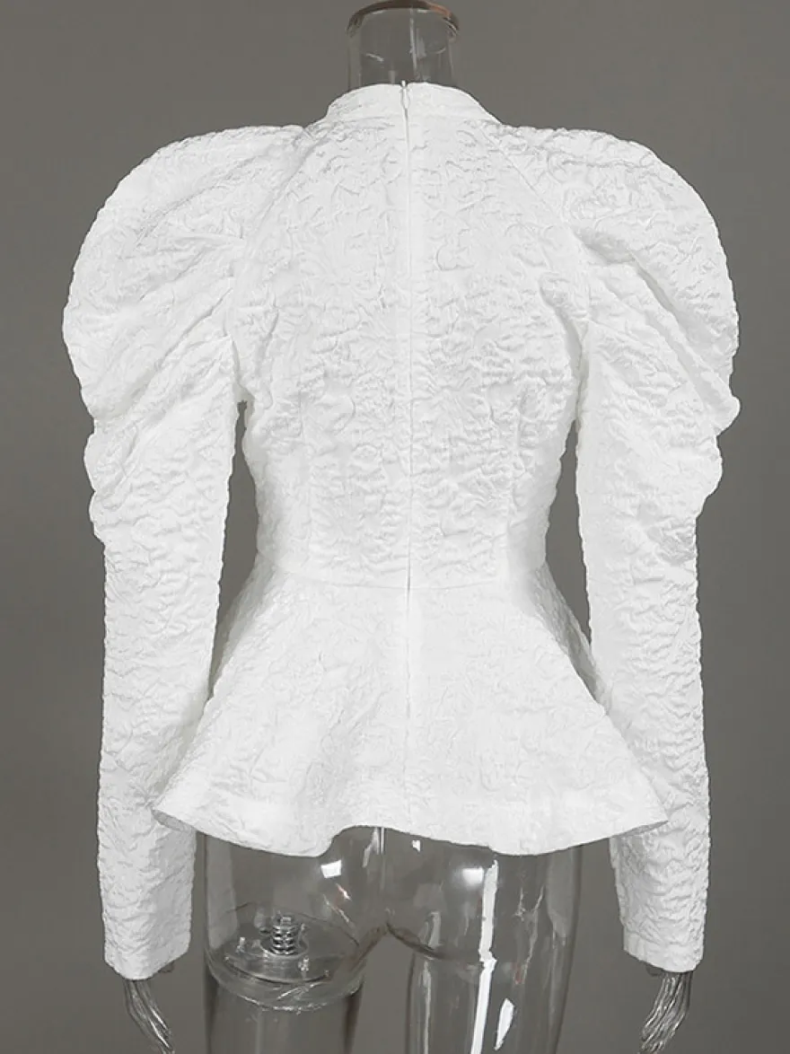 Blouse texturée en jacquard à manches bouffantes col montant taille péplum ourlet évasé
