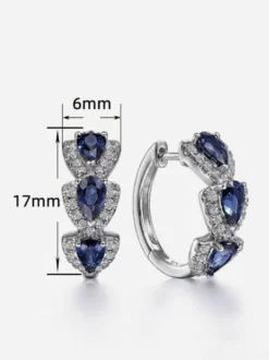 Boucles d'oreilles blanches pour adulte style western décontracté design géométrique en forme de goutte.