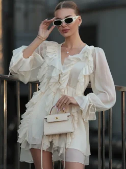 Chemise blanche à volants pour femme col en V manches longues élégantes