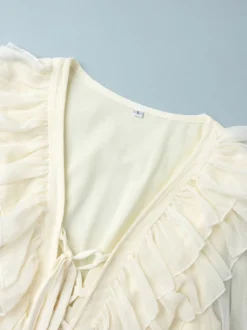 Chemise blanche à volants pour femme col en V manches longues élégantes