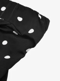 Combinaison noire sans manches et sans bretelles ample tenue d'été une pièce
