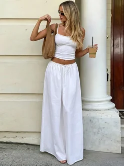 Ensemble de vacances deux pièces : débardeur court à bordure en dentelle blanche jupe maxi large à cordon de serrage