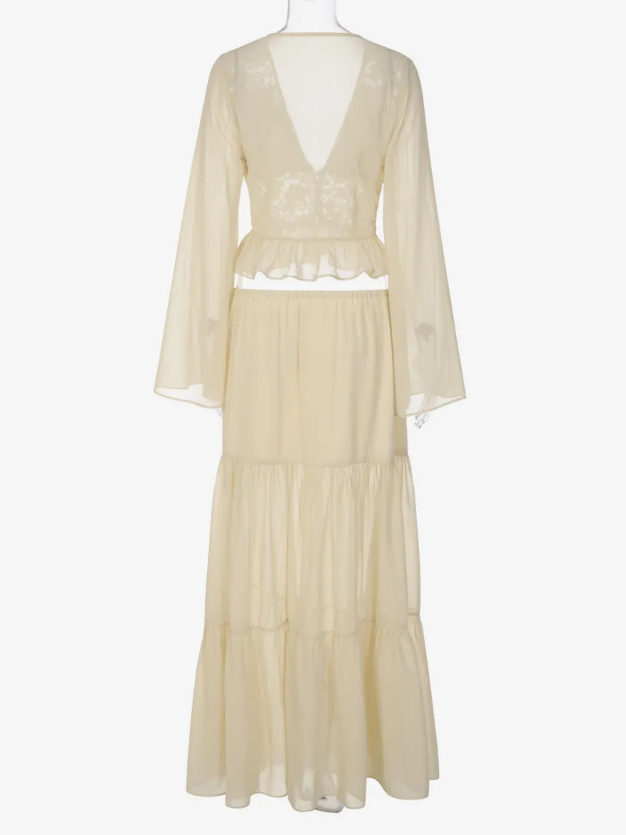 Ensembles deux pièces : jupe robe maxi couleur abricot tenue de villégiature boutons col en V manches longues.