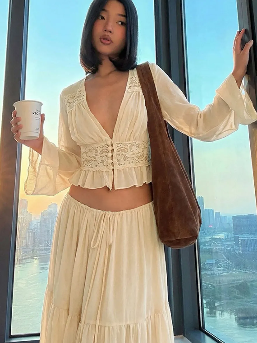 Ensembles deux pièces : jupe robe maxi couleur abricot tenue de villégiature boutons col en V manches longues.