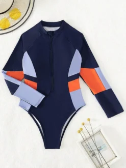 Maillot de bain une pièce de surf à manches longues et fermeture éclair sur le devant empiècements colorés