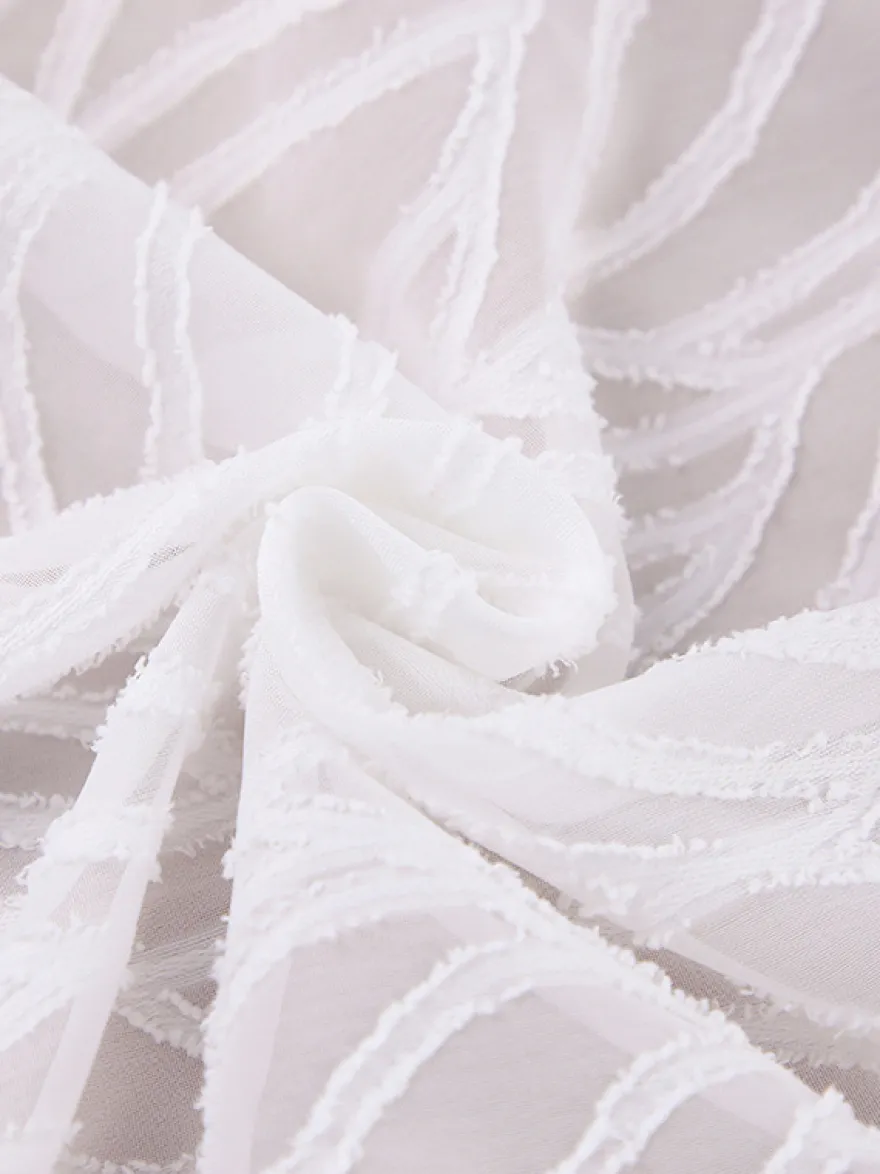 Mini-robe en jacquard à col en V et manches longues pour l'été 2026