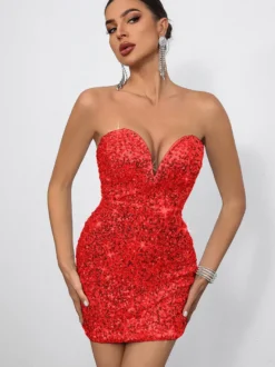 Mini-robe moulante à sequins décolleté en cœur et nœud dans le dos idéale pour les fêtes 2026