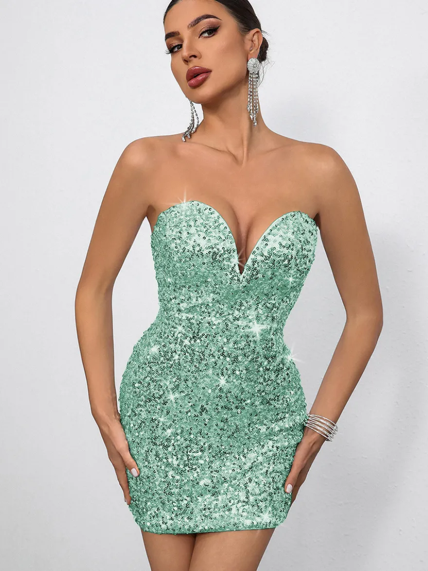 Mini-robe moulante à sequins décolleté en cœur et nœud dans le dos idéale pour les fêtes 2026