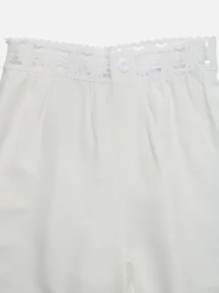 Pantalon large à taille en dentelle pour femme blanc crème taille haute élastique
