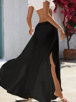 Pantalon palazzo fluide à taille haute élastique et fentes latérales pour femme idéal comme paréo de plage.