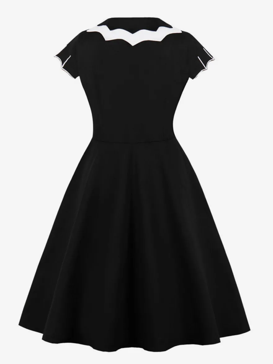 Robe cocktail vintage sans manches style swing années 1950