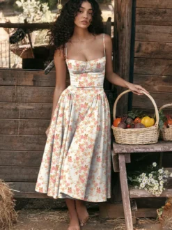 Robe corset rose pâle à bretelles spaghetti dos nu plissée mi-longue style cottagecore 2026