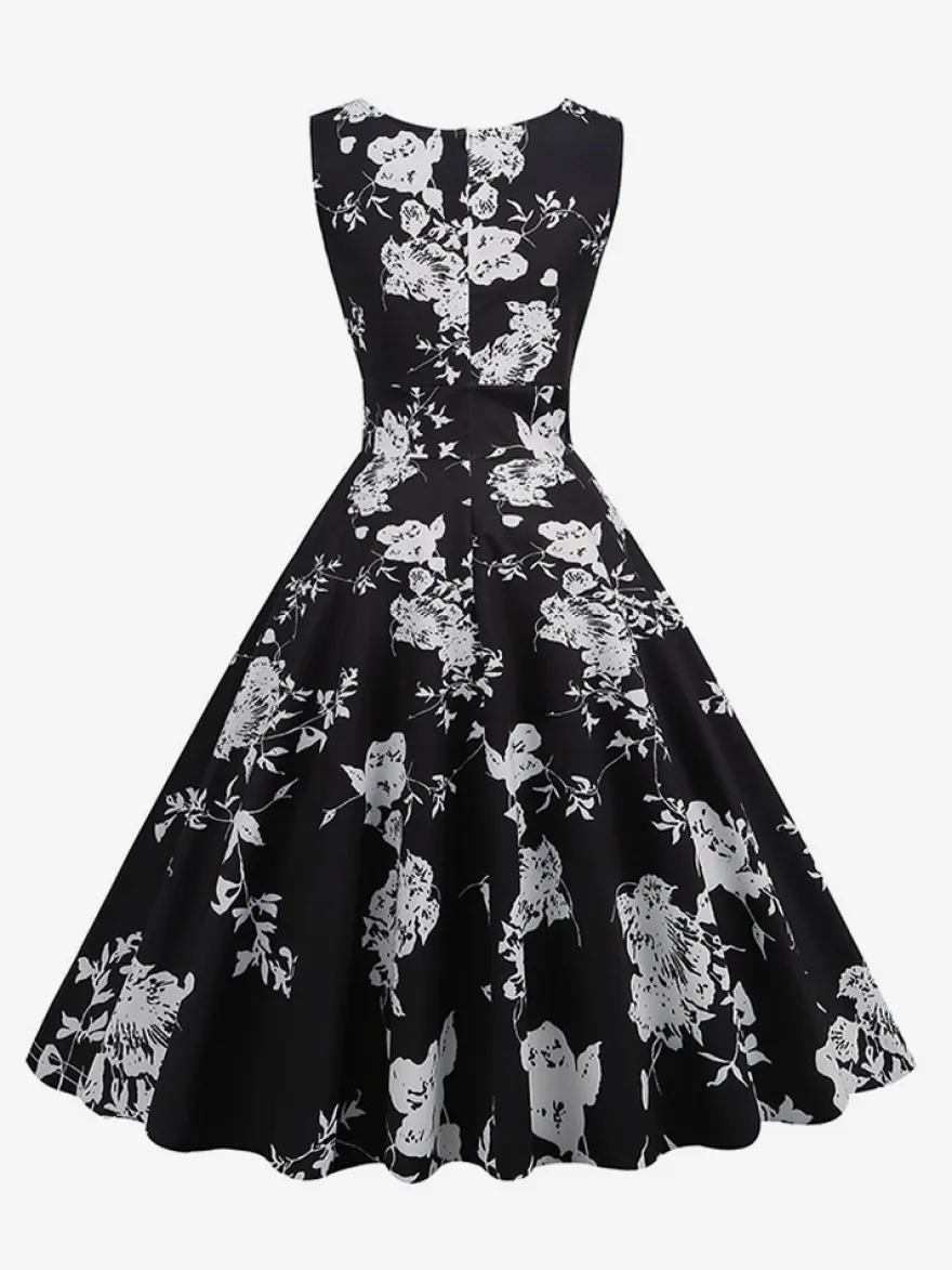 Robe de cocktail vintage années 50 col en V sans manches imprimé floral coupe trapèze taille haute sans manches.