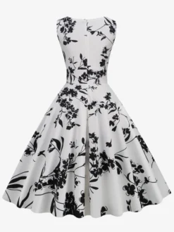 Robe de cocktail vintage années 50 col en V sans manches imprimé floral coupe trapèze taille haute sans manches.
