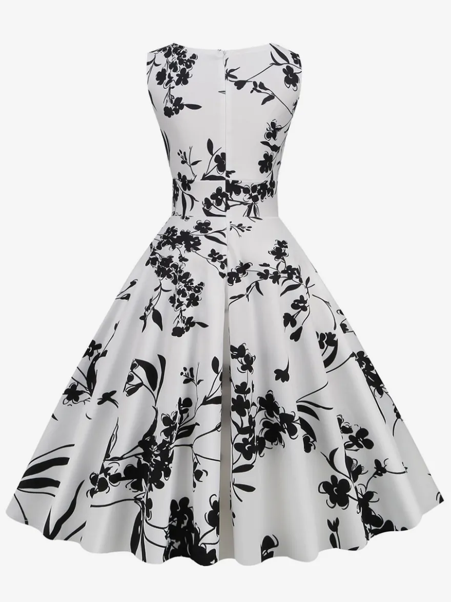 Robe de cocktail vintage années 50 col en V sans manches imprimé floral coupe trapèze taille haute sans manches.
