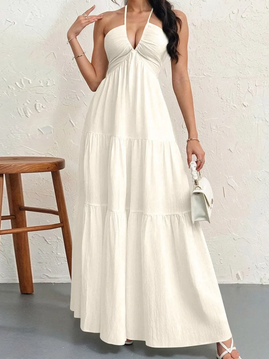 Robe de plage longue maxi fluide à dos nu et col halter en V ornée de volants superposés idéale pour les vacances d'été.