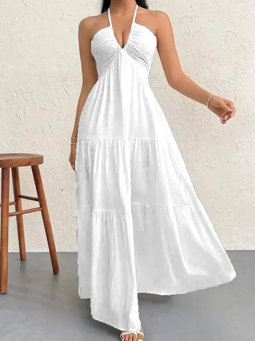Robe de plage longue maxi fluide à dos nu et col halter en V ornée de volants superposés idéale pour les vacances d'été.