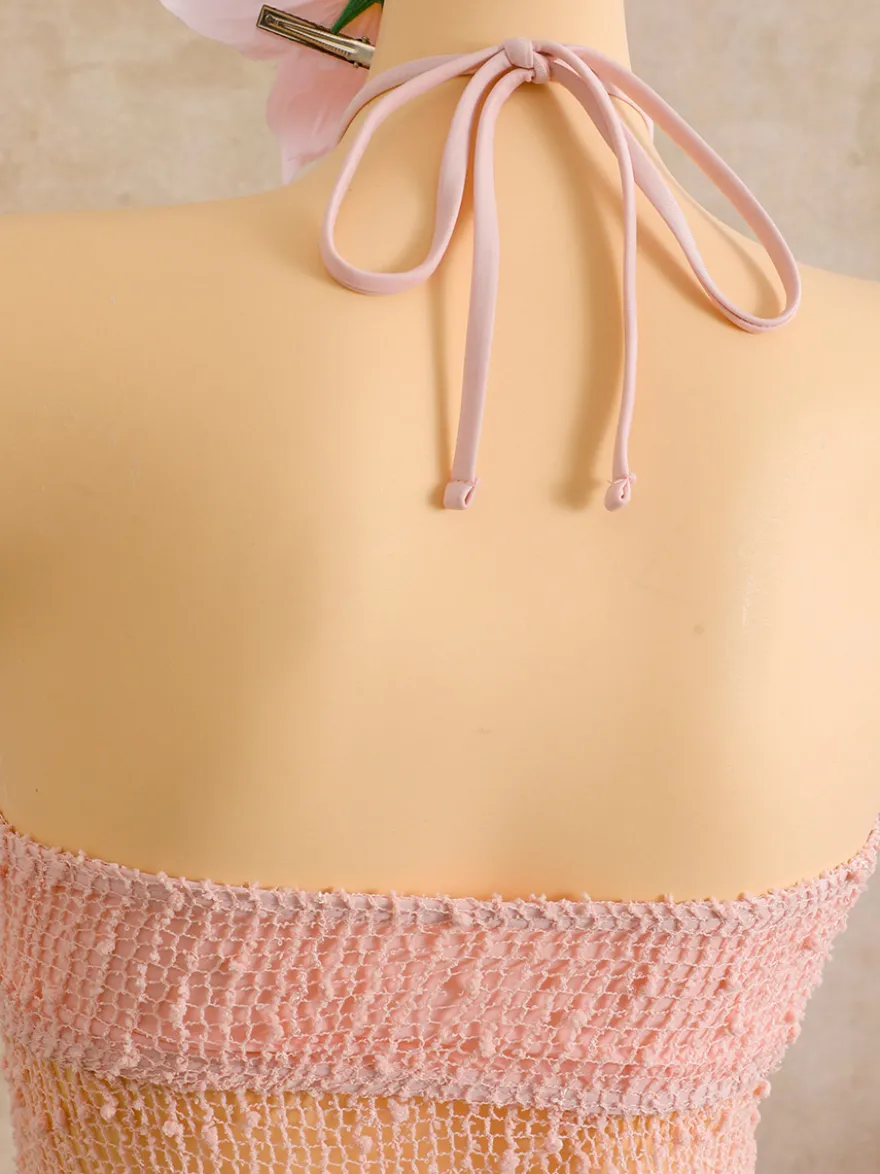 Robe de plage midi dos nu à boutons soleil en maille ajourée transparente