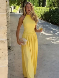 Robe de soirée jaune maxi dos nu sans manches à taille froncée longue et fluide
