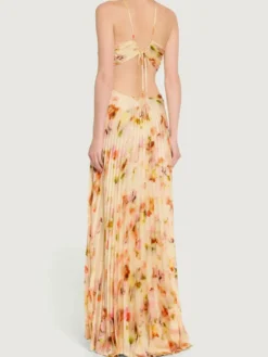 Robe de soirée longue à bretelles spaghetti et dos nu imprimé floral style bohème idéale pour l'été et la plage.