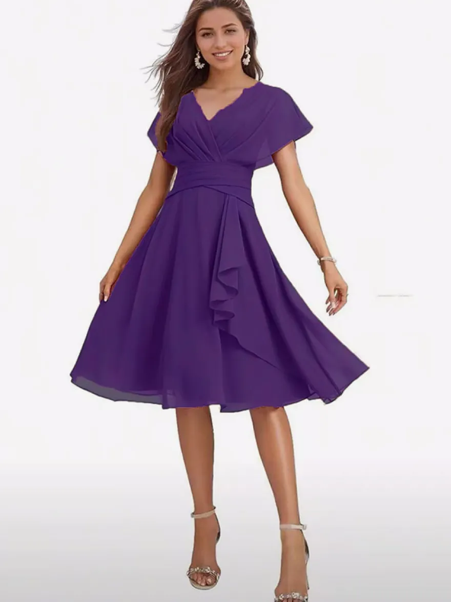 Robe de soirée midi en mousseline à col V manches papillon taille froncée et ourlet à volants.