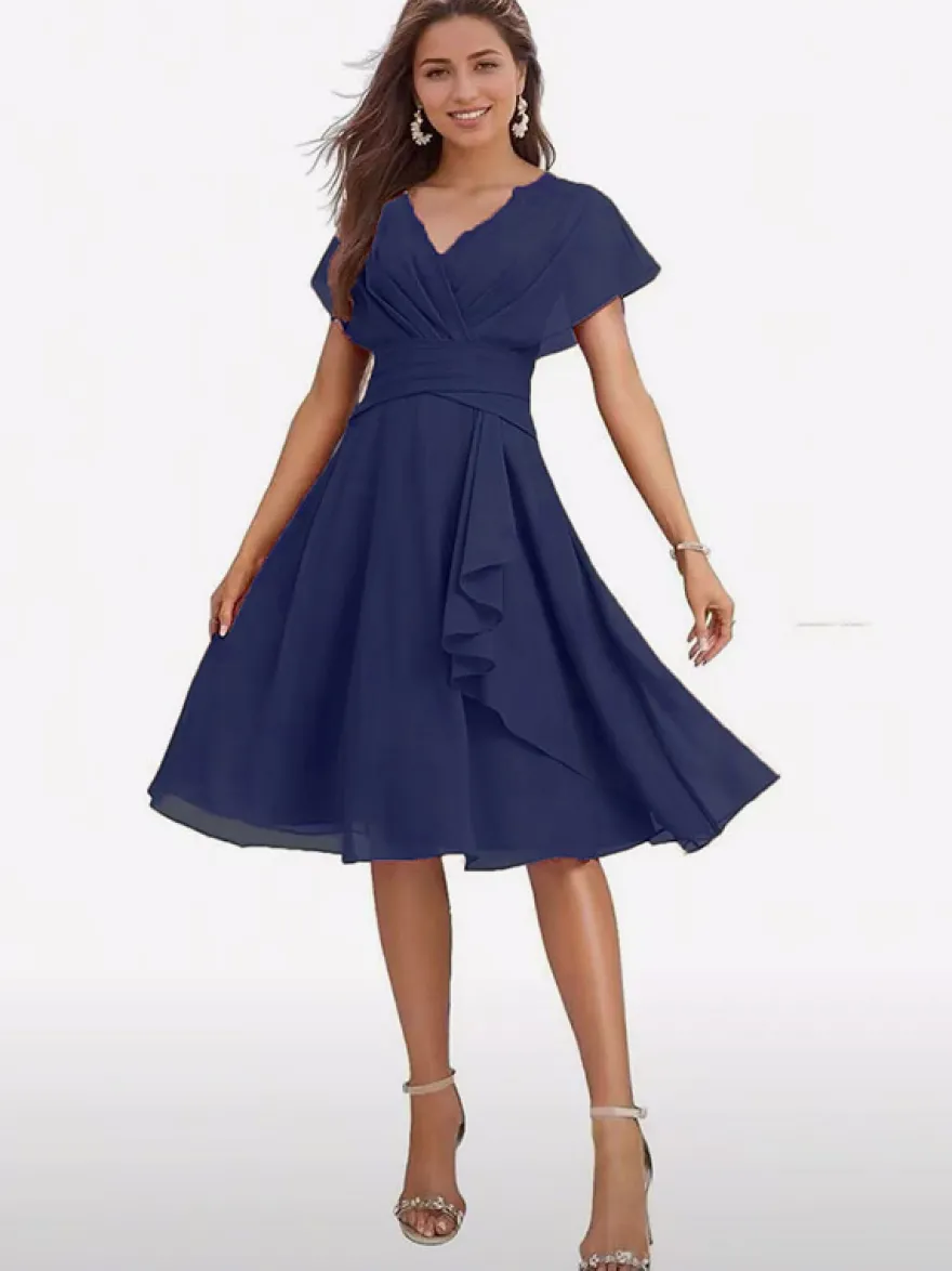 Robe de soirée midi en mousseline à col V manches papillon taille froncée et ourlet à volants.