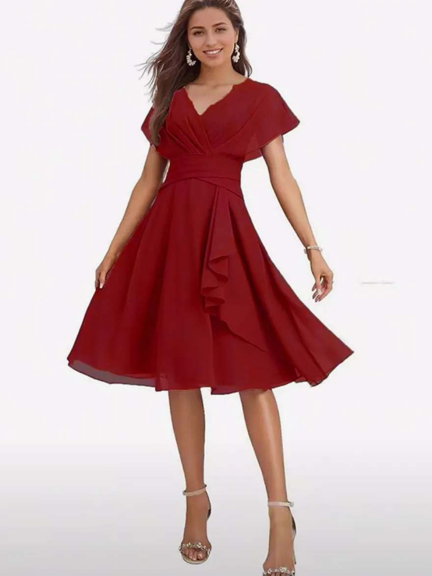 Robe de soirée midi en mousseline à col V manches papillon taille froncée et ourlet à volants.