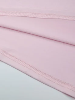 Robe de soirée moulante rose poudré à décolleté plongeant et dos nu froncé