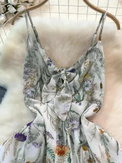Robe de vacances maxi dos nu à fleurs bretelles fines sans manches imprimé floral col chic couleur abricot