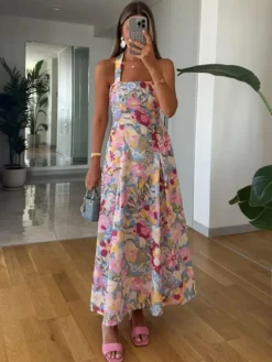 Robe de vacances sculptante dos nu en dentelle sans manches à bretelles imprimées rose élégante