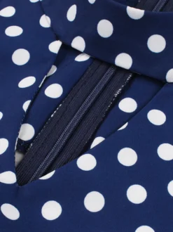 Robe dos nu vintage à pois sans manches col ajouré style rétro taille haute coupe évasée mi-longue