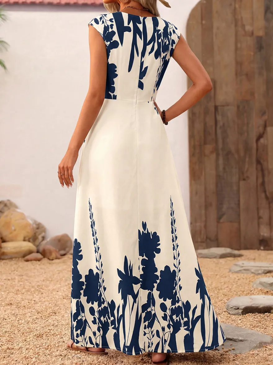 Robe d'été bohème bleu foncé à imprimé floral col carré sans manches fluide style bohème idéale pour la plage.