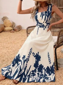 Robe d'été bohème bleu foncé à imprimé floral col carré sans manches fluide style bohème idéale pour la plage.