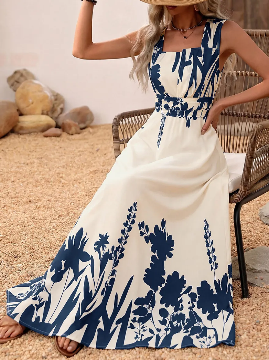 Robe d'été bohème bleu foncé à imprimé floral col carré sans manches fluide style bohème idéale pour la plage.