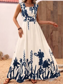 Robe d'été bohème bleu foncé à imprimé floral col carré sans manches fluide style bohème idéale pour la plage.