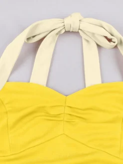 Robe jaune dos nu vintage swing avec ceinture blanche contrastante style rockabilly rétro années 50