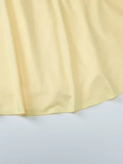 Robe jaune sexy mini à lacets sans manches dos nu et bretelles.