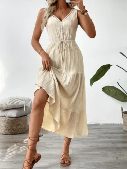 Robe longue bohème à volants pour femme - Couleur abricot texturée col en V sans manches taille nouée coupe trapèze - Collection été 2026