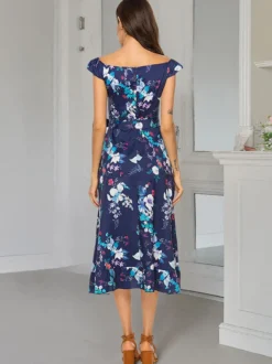 Robe longue d'été élégante à imprimé floral épaules dénudées sans manches et fermeture éclair.