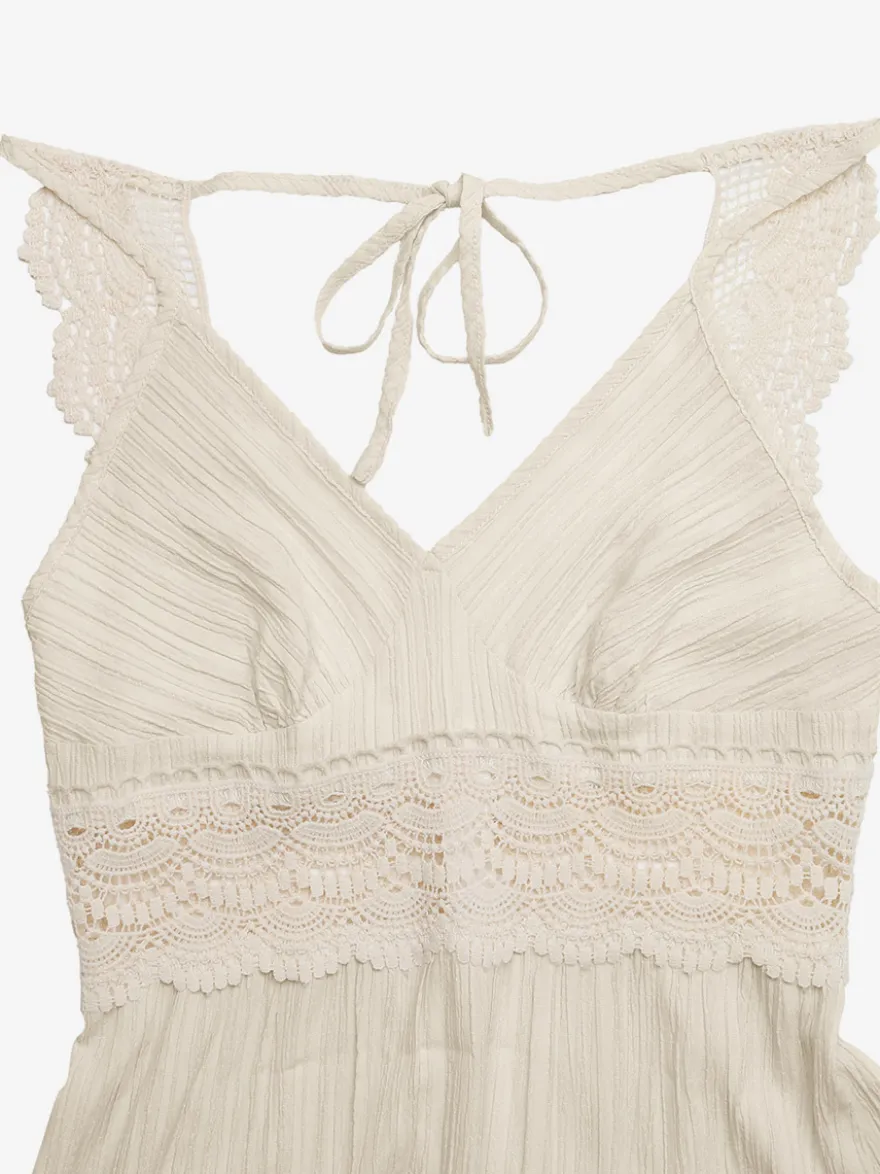 Robe longue fluide d'été pour femme couleur crème avec bretelles spaghetti et taille en dentelle blanche col en V.