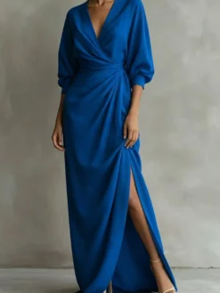 Robe longue portefeuille à col en V manches bouffantes ceinture à nouer fente et poches latérales