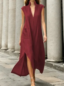 Robe maxi en lin sans manches à col montant et décolleté en V fente latérale coupe ample idéale pour les vacances.