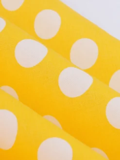 Robe midi vintage à pois bretelles doubles nœud sur le devant coupe trapèze jaune