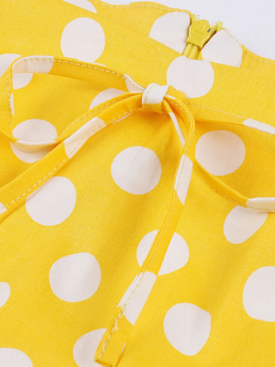Robe midi vintage à pois bretelles doubles nœud sur le devant coupe trapèze jaune