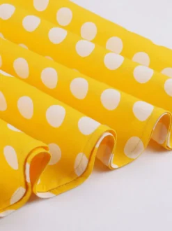 Robe midi vintage à pois bretelles doubles nœud sur le devant coupe trapèze jaune