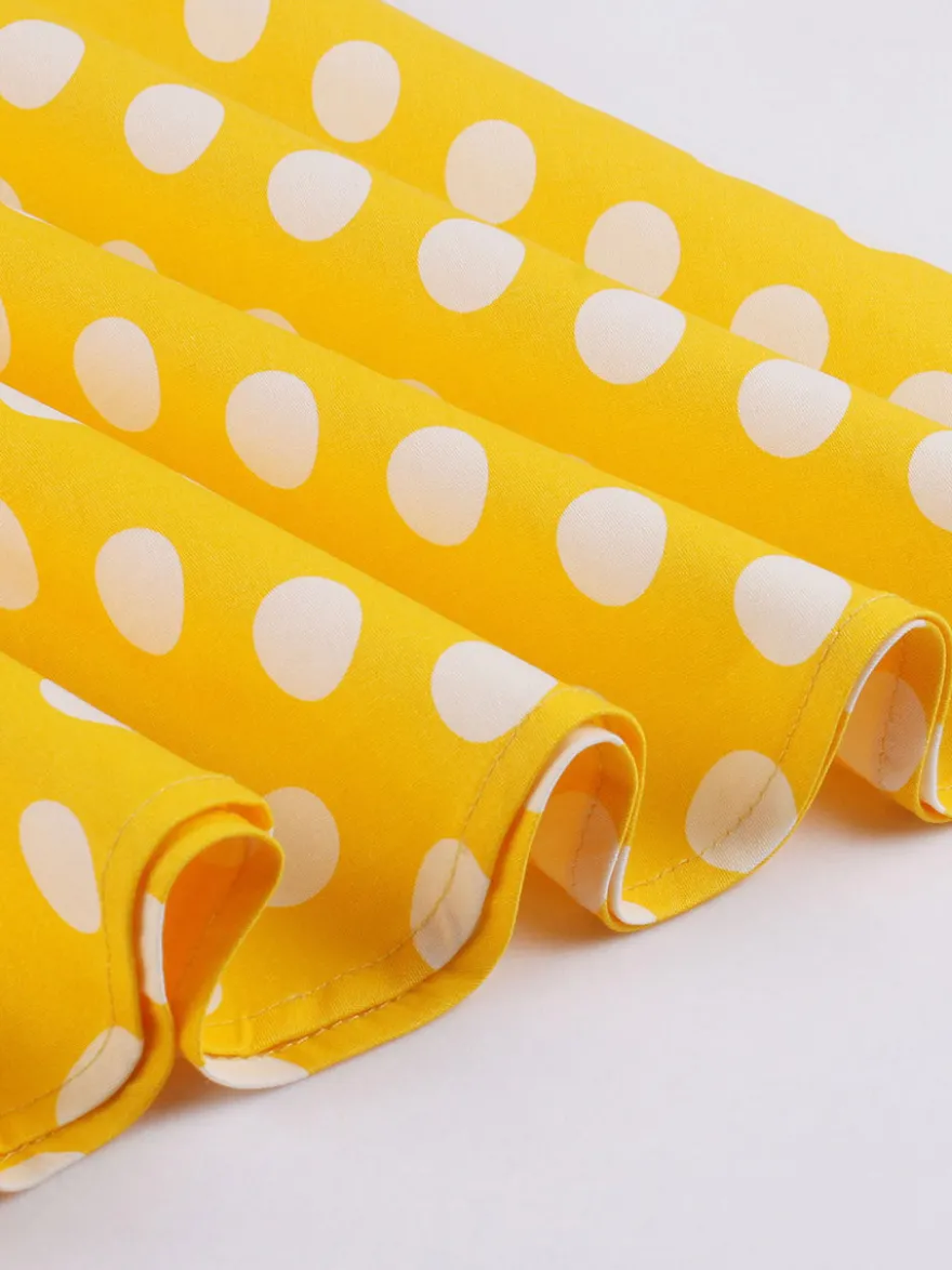 Robe midi vintage à pois bretelles doubles nœud sur le devant coupe trapèze jaune
