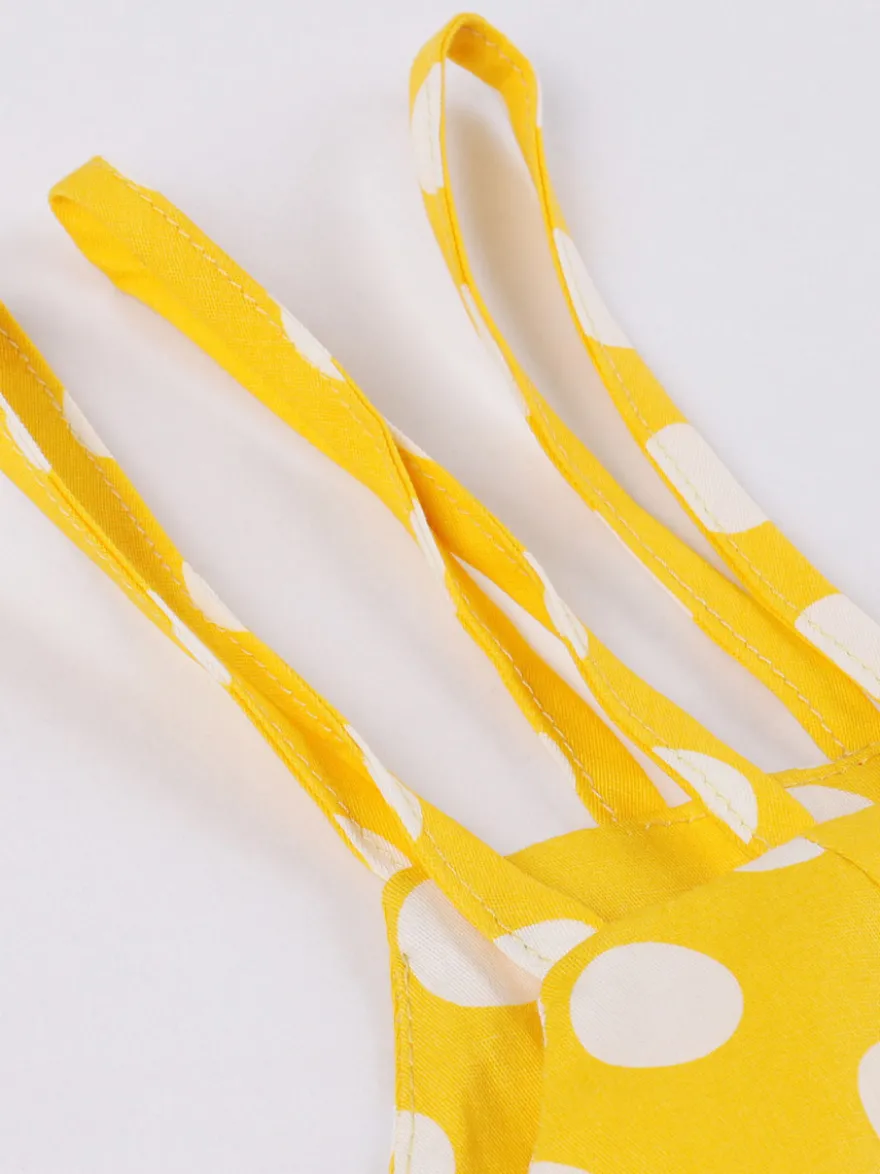 Robe midi vintage à pois bretelles doubles nœud sur le devant coupe trapèze jaune