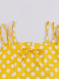 Robe midi vintage à pois bretelles doubles nœud sur le devant coupe trapèze jaune